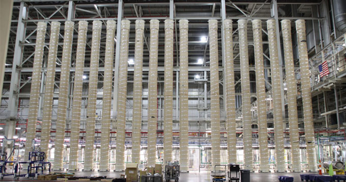 A uranium processing facility with long pipes reaching to the ceiling